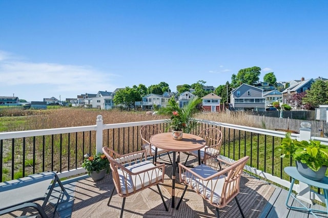 12 Moreland Ave Unit 1, Hull, MA 02045 - wooden terrace with a residential view and outdoor dining space