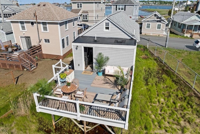 12 Moreland Ave Unit 1, Hull, MA 02045 - rear view of property featuring a deck with water view, a fenced backyard, and a residential view