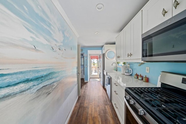 12 Moreland Ave Unit 1, Hull, MA 02045 - kitchen with stainless steel appliances, dark wood finished floors, white cabinets, light countertops, and a sink
