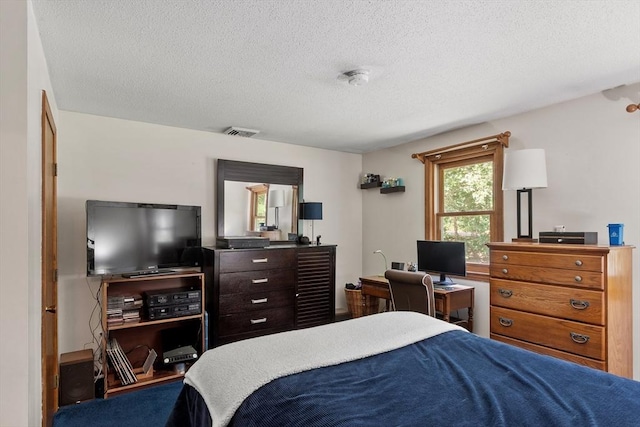 65 Martin Rd, Tewksbury, MA 01876 - bedroom featuring a textured ceiling and a desk