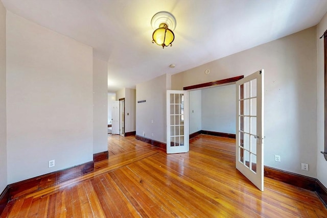 70 Revere St Unit 5, Boston, MA 02114 - spare room featuring french doors, light wood-style flooring, and baseboards