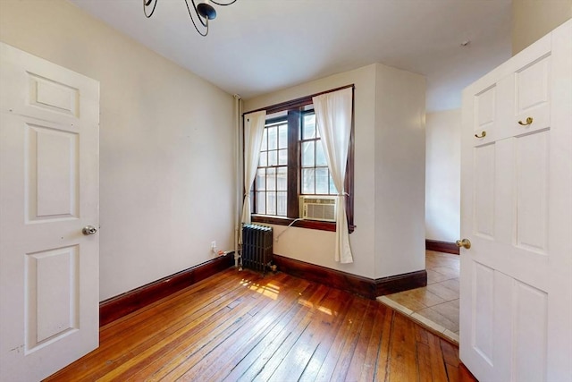 70 Revere St Unit 5, Boston, MA 02114 - unfurnished room featuring radiator, wood-type flooring, baseboards, a chandelier, and cooling unit