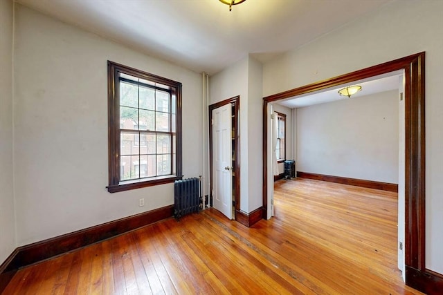70 Revere St Unit 5, Boston, MA 02114 - unfurnished room featuring radiator, light wood-type flooring, and baseboards