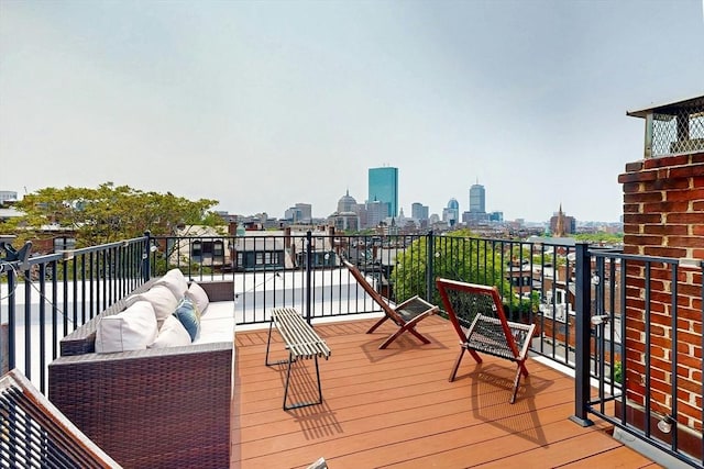 70 Revere St Unit 5, Boston, MA 02114 - wooden deck with a skyline view and outdoor lounge area