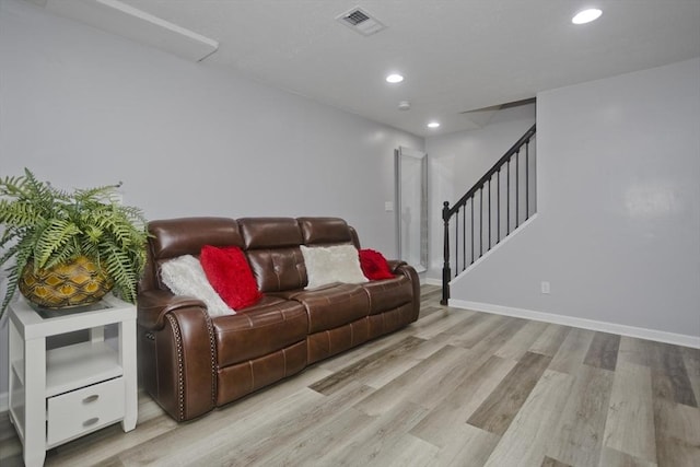 living room featuring recessed lighting, visible vents, stairway, wood finished floors, and baseboards