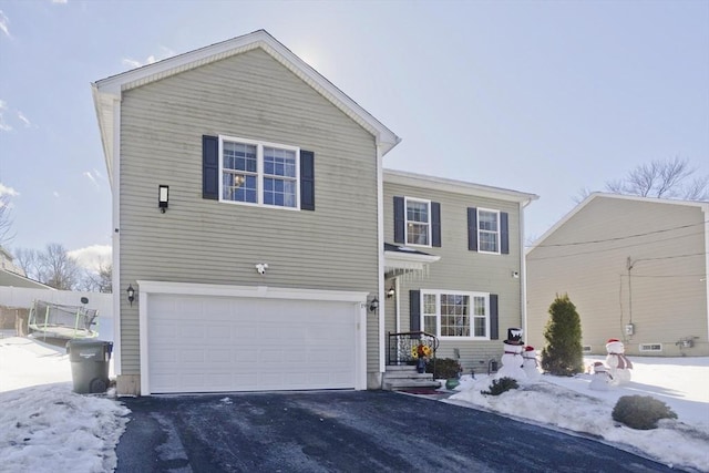 view of front of property with a garage and driveway