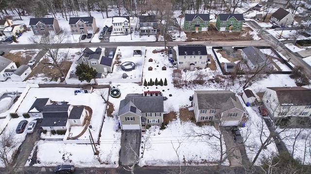 snowy aerial view featuring a residential view