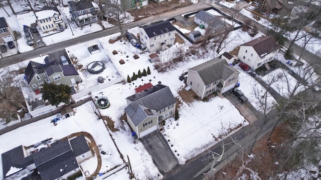 snowy aerial view with a residential view