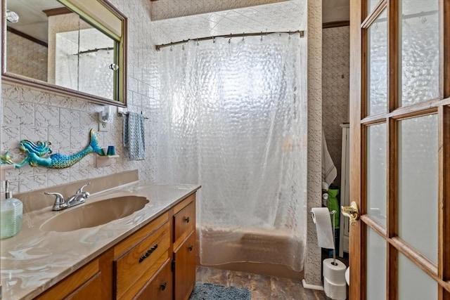 bathroom featuring vanity and shower / tub combo with curtain