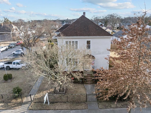 view of side of property featuring a fenced front yard