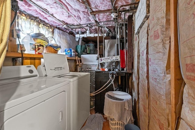 washroom featuring washer and dryer and laundry area