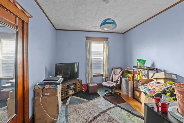 interior space with ornamental molding and wood finished floors