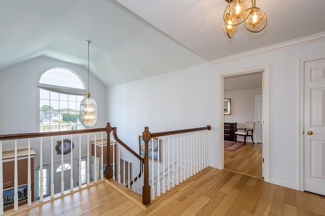 113 Sparrow Rd, Stoughton, MA 02072 - corridor with a chandelier, an upstairs landing, wood finished floors, and vaulted ceiling