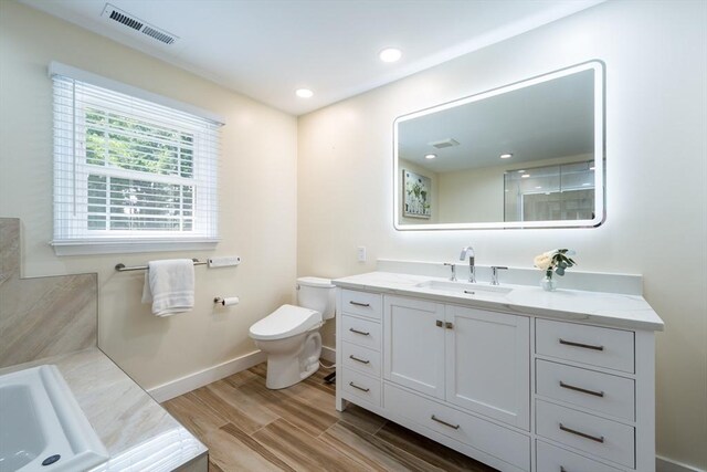 113 Sparrow Rd, Stoughton, MA 02072 - bathroom featuring vanity, a tub, and wood finished floors