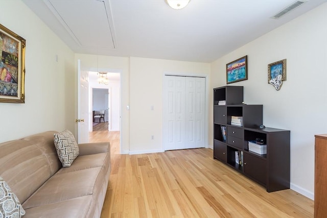 113 Sparrow Rd, Stoughton, MA 02072 - living area with attic access and light wood finished floors