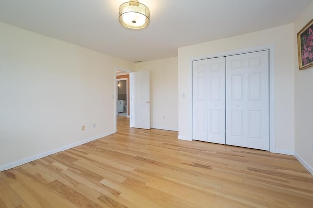 113 Sparrow Rd, Stoughton, MA 02072 - unfurnished bedroom with light wood finished floors and a closet