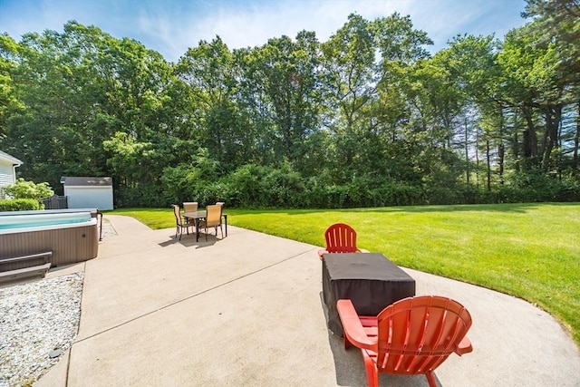 113 Sparrow Rd, Stoughton, MA 02072 - view of patio with a hot tub and a storage shed