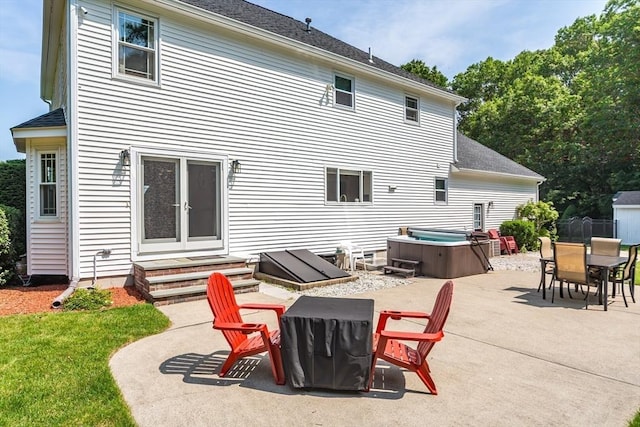 113 Sparrow Rd, Stoughton, MA 02072 - back of house featuring a patio, a hot tub, outdoor dining space, entry steps, and roof with shingles
