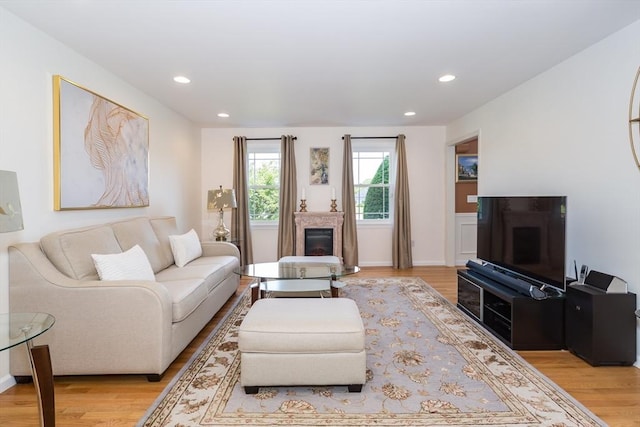 113 Sparrow Rd, Stoughton, MA 02072 - living area featuring a glass covered fireplace, light wood finished floors, and recessed lighting