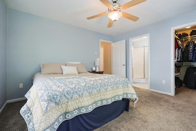 carpeted bedroom featuring baseboards, a spacious closet, ceiling fan, and a closet