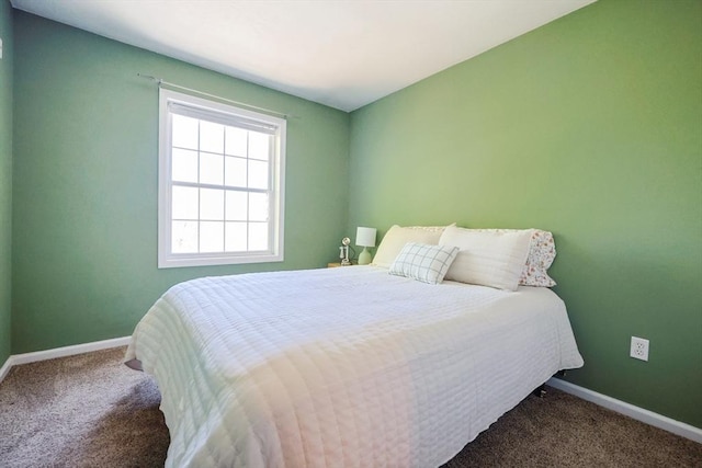 bedroom featuring carpet flooring and baseboards