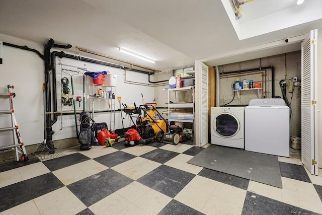 interior space with washer and dryer, laundry area, and tile patterned floors
