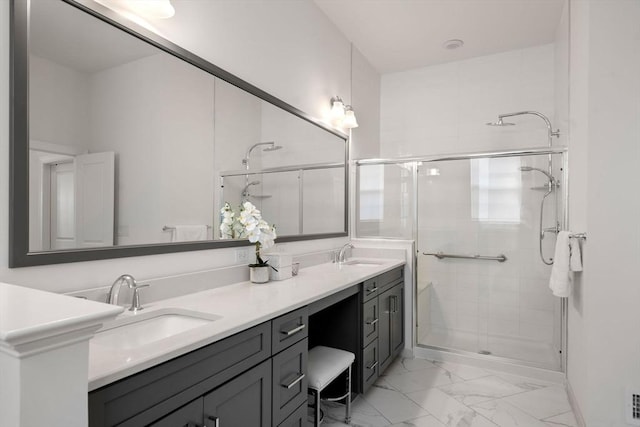 21 Snapping Bow, Plymouth, MA 02360 - bathroom featuring marble look tile flooring, a shower stall, and double vanity