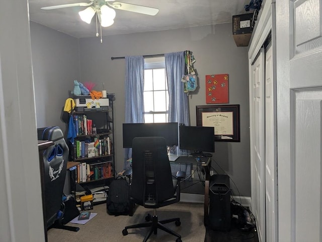 home office featuring ceiling fan, carpet floors, and baseboards