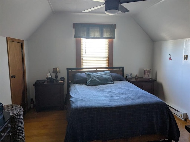 bedroom featuring vaulted ceiling, ceiling fan, baseboard heating, and wood finished floors