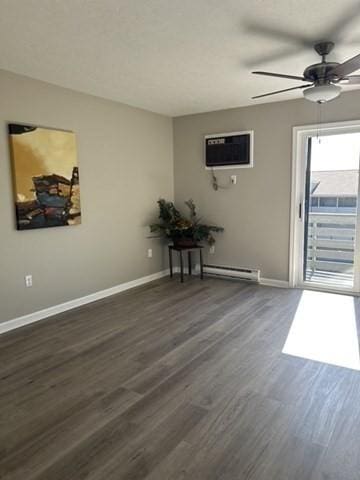 unfurnished room featuring a ceiling fan, baseboards, dark wood-type flooring, a wall mounted air conditioner, and baseboard heating