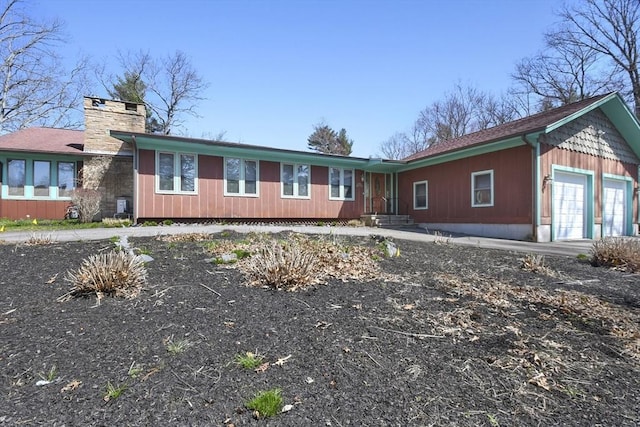 210 Plain Dr, Stoughton, MA 02072 - ranch-style home featuring an attached garage and a chimney