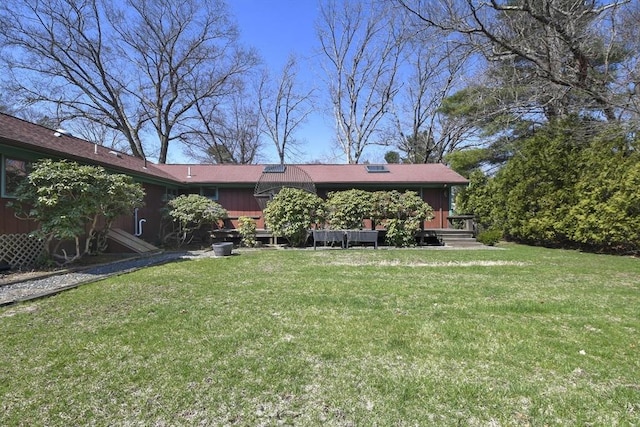 210 Plain Dr, Stoughton, MA 02072 - back of property with a lawn