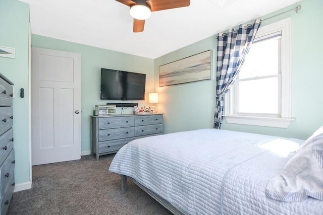 bedroom with baseboards, carpet floors, and a ceiling fan