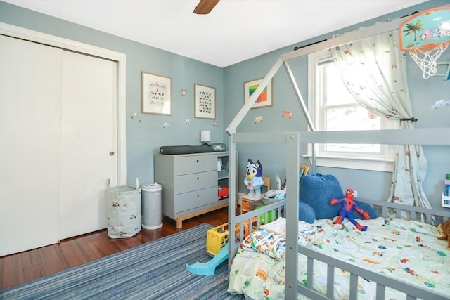 bedroom featuring a closet, ceiling fan, and wood finished floors