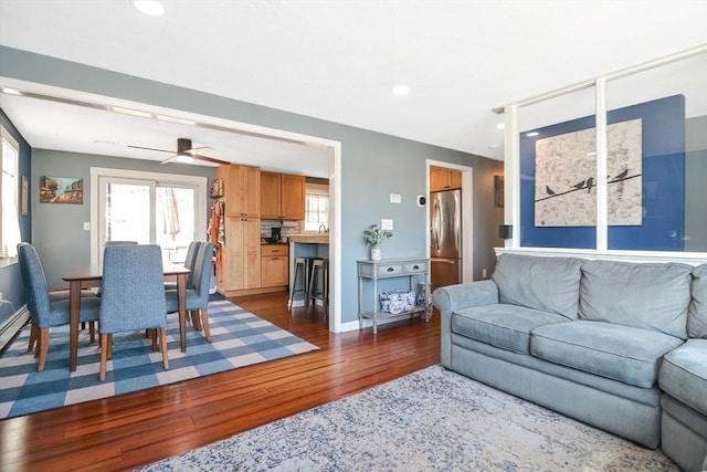 living area featuring recessed lighting, baseboards, ceiling fan, and dark wood-style flooring