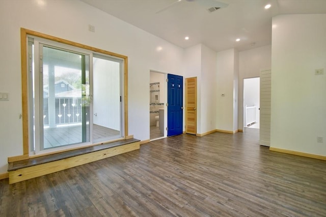 spare room featuring dark wood-style flooring, baseboards, a ceiling fan, and recessed lighting