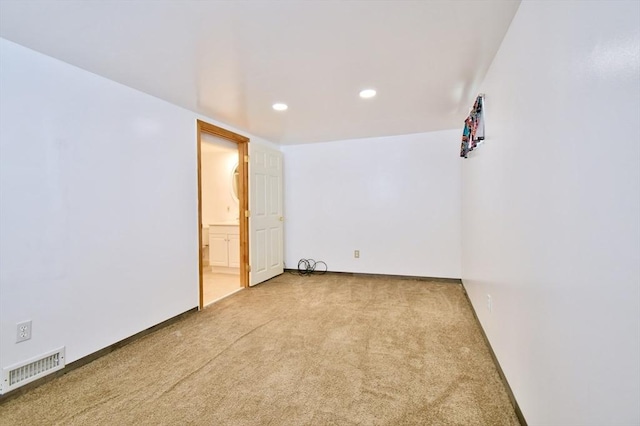 carpeted spare room with recessed lighting