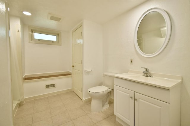 bathroom with tile patterned floors, toilet, vanity, a shower with shower curtain, and baseboards
