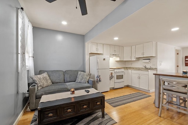 18 Doyle St, Lawrence, MA 01841 - living area featuring ceiling fan, light wood-style floors, and recessed lighting