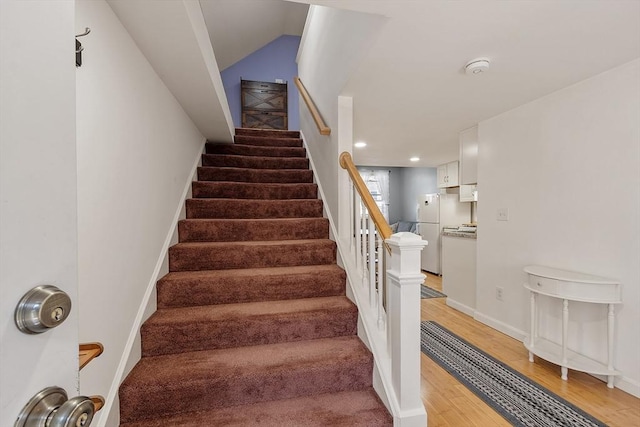 18 Doyle St, Lawrence, MA 01841 - staircase with wood finished floors, baseboards, and recessed lighting