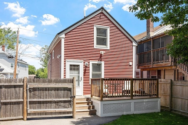 18 Doyle St, Lawrence, MA 01841 - back of property with a wooden deck