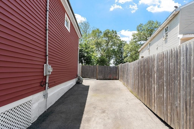 18 Doyle St, Lawrence, MA 01841 - view of side of property with a patio and a fenced backyard