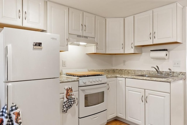 18 Doyle St, Lawrence, MA 01841 - kitchen with white appliances, under cabinet range hood, a sink, white cabinetry, and light countertops