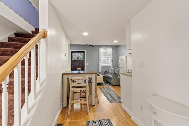 18 Doyle St, Lawrence, MA 01841 - hallway featuring light wood-style floors, stairs, recessed lighting, and baseboards