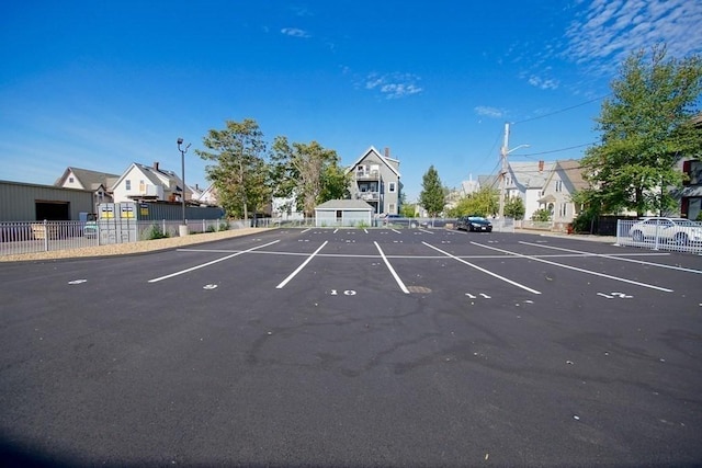 uncovered parking lot with fence