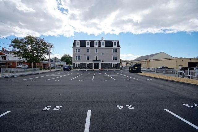 view of car parking featuring fence