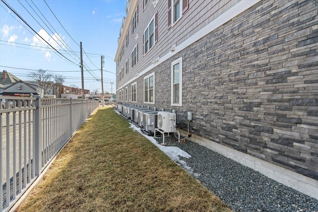 view of yard with ac unit and a fenced backyard