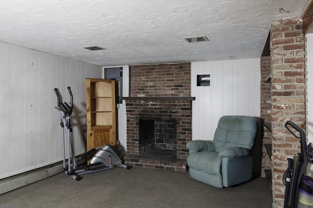 708 Berkley St, Berkley, MA 02779 - exercise area with a brick fireplace, carpet, a textured ceiling, and wood walls