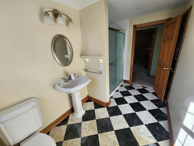 bathroom featuring toilet and walk in shower