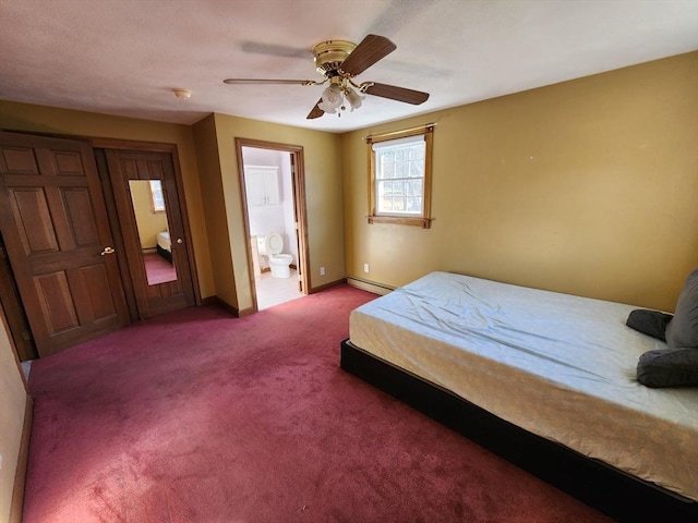 carpeted bedroom featuring ensuite bath, ceiling fan, and a baseboard heating unit